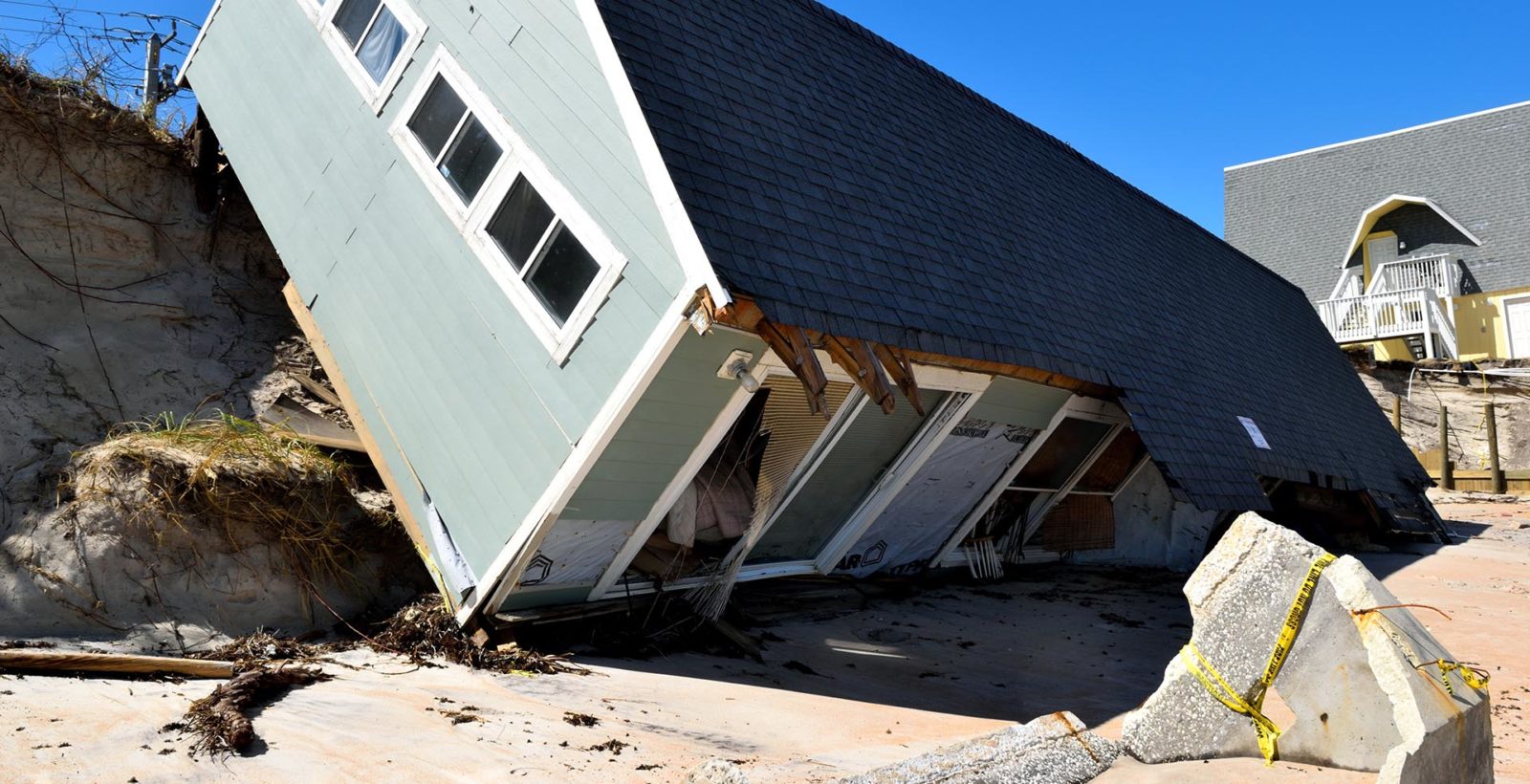 house damaged by hurricane winds
