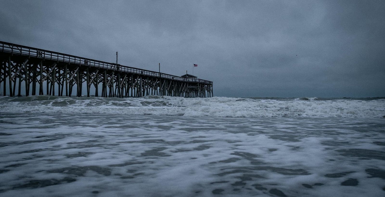 pier and ocean during a storm
